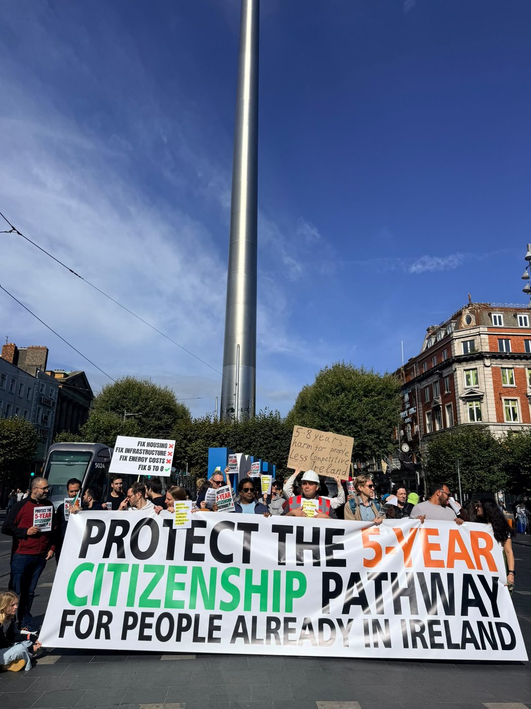 The march gathering under the Spire on O’Connell Street behind a banner reading ‘Protect the 5-year citizenship pathway for people already in Ireland’